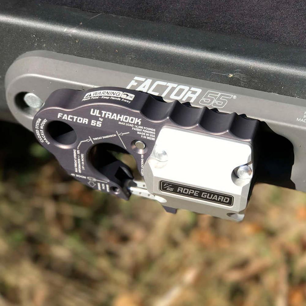 A picture of a Factor 55 FlatLink XXL Rope Guard 00384, attached to a vehicle, providing protection.