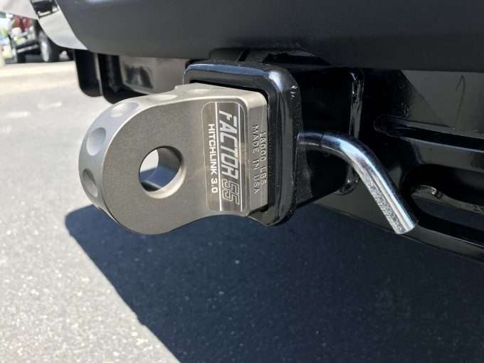 A truck with a Factor 55 HITCHLINK 3.0 hitch receiver attached to it.