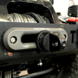 A close up of a black bumper on a jeep with Factor 55 Shackle Mount in Gray 00015-04 winch hooks.