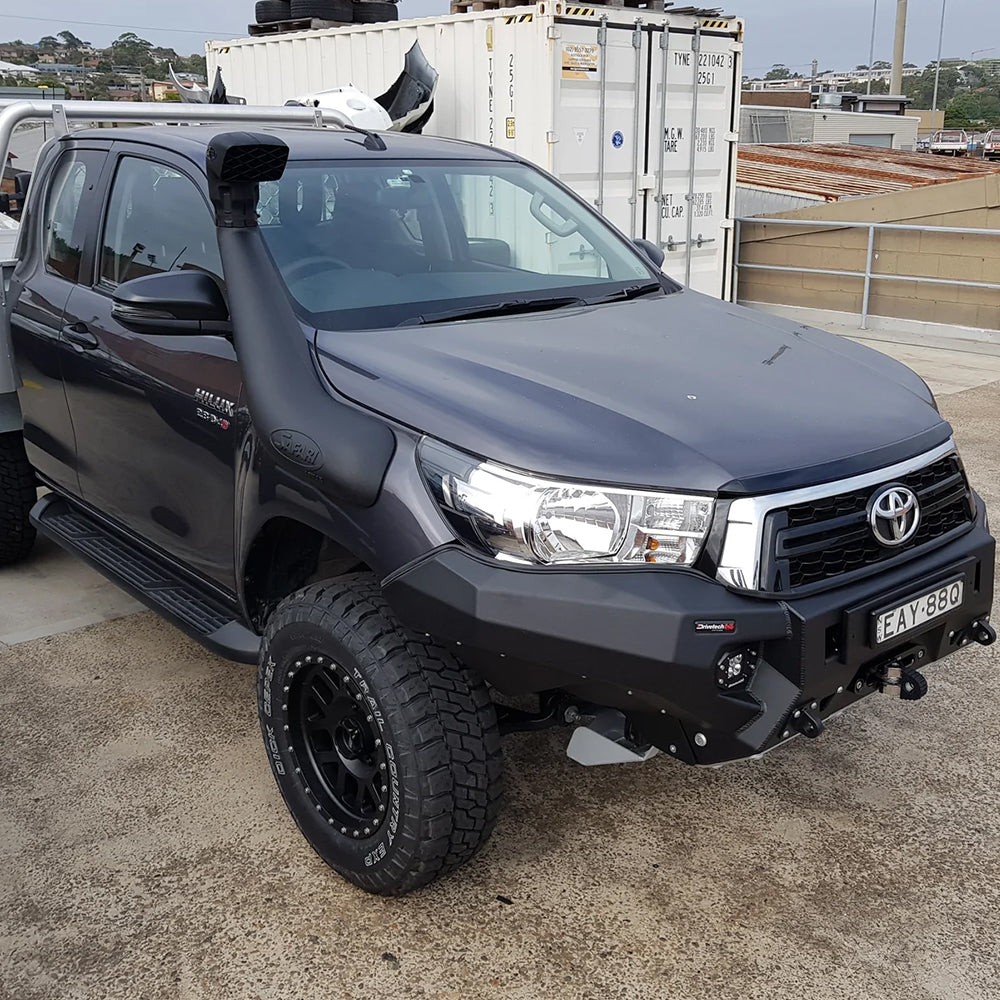 A Safari Snorkel Intake Kit SS123HP for Toyota Hilux (2015-2022) parked in a parking lot.