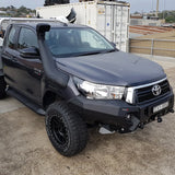 A Safari Snorkel Intake Kit SS123HP for Toyota Hilux (2015-2022) parked in a parking lot.