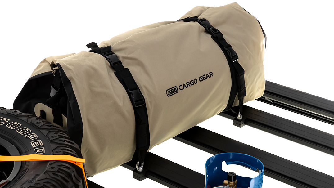 A bag on an ARB Rack with ARB Eye Bolt Tie-Downs (Set Of Four) 1780200.
