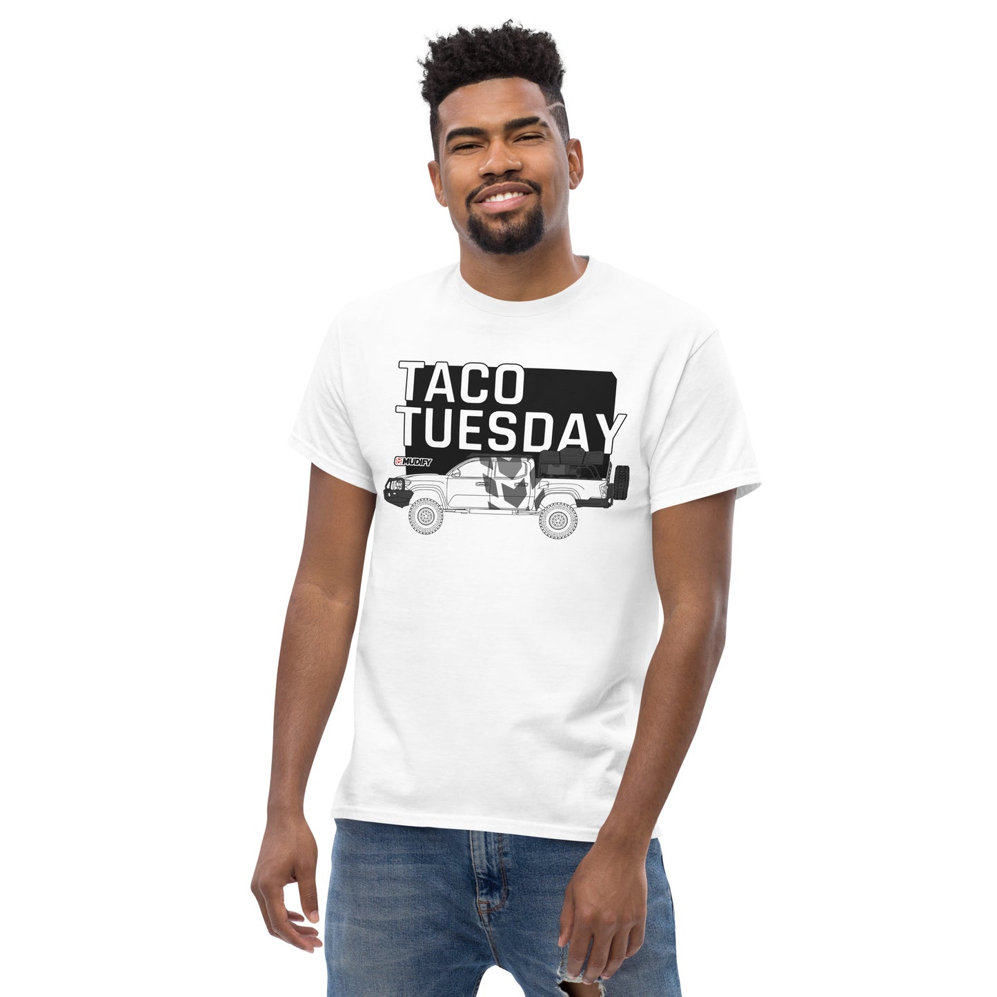 A man wearing a Mudify Taco Tuesday Tee, made from 100% cotton.