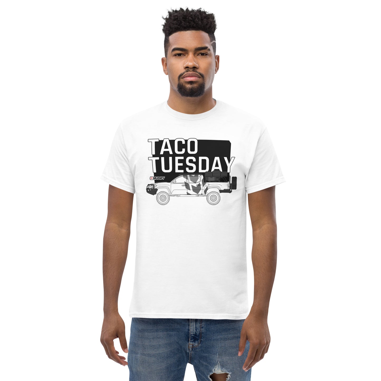 A man wearing a Taco Tuesday Tee by Mudify with the words 'coo tuesday' on it.