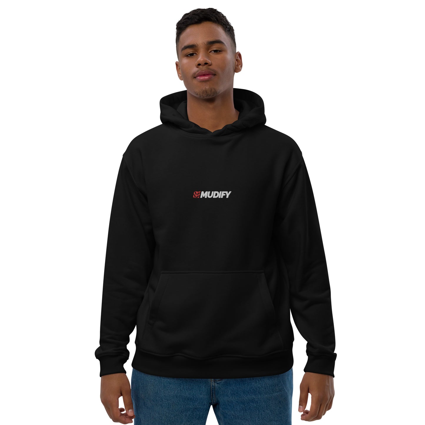 A man wearing a Mudify Premium Eco Hoodie made of organic and recycled materials, featuring a Mudify logo on it.