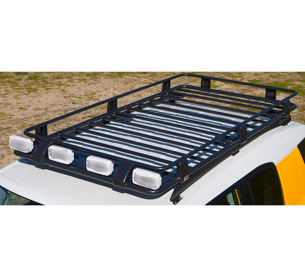 A white SUV with a Steel Roof Rack Basket For Toyota FJ Cruiser 2010-2016 ARB 3800200 on top.