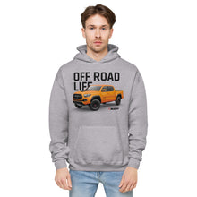Load image into Gallery viewer, A stylish man wearing a Mudify Taco Life fleece hoodie that says off road life.