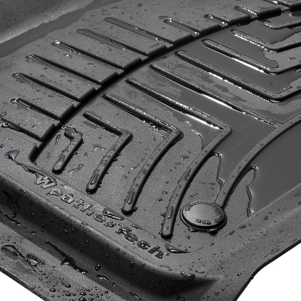 A Weathertech Floorliner HP 2nd Row Floor Mat for Toyota 4Runner (2013-2023) with water on it is designed for extreme weather environments.